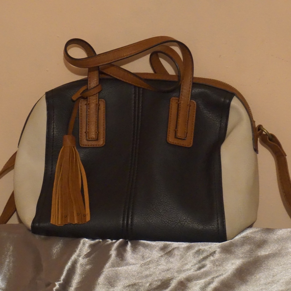 A black and white w/brown straps purse